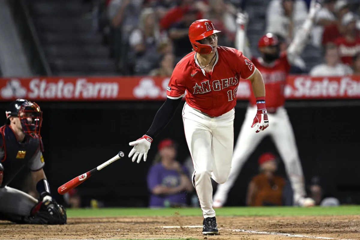 Mickey Moniak (16) of the Los Angeles Angels hits an RBI double in the sixth inning against the Atlanta Braves in Anaheim, Calif., on Aug. 16, 2024. (Orlando Ramirez/Getty Images)