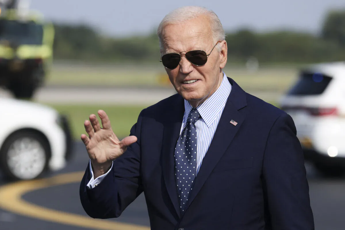 President Joe Biden waves as he walks to his car upon arrival at Philadelphia International Airport in Philadelphia on Aug. 16, 2024. (Samuel Corum/AFP via Getty Images)