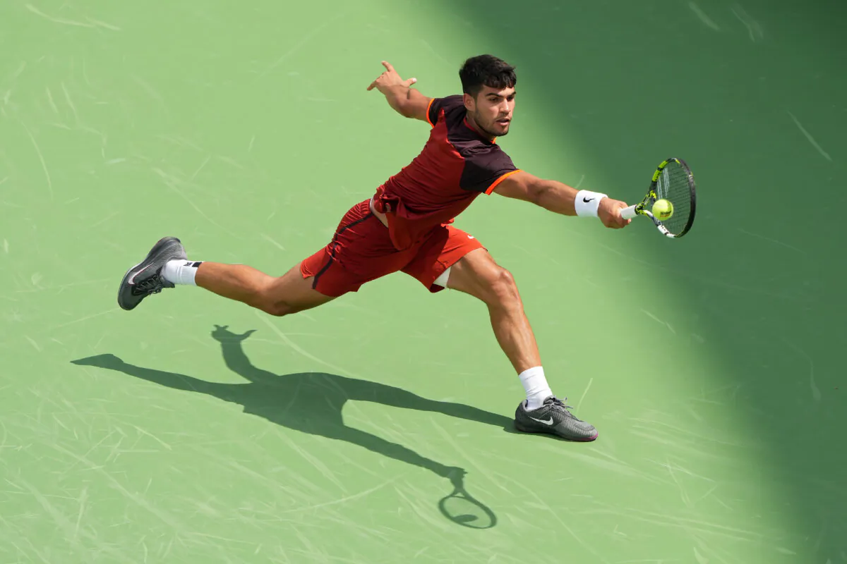 Carlos Alcaraz of Spain plays a backhand during his match against Gael Monfils of France during Day 6 of the Cincinnati Open at the Lindner Family Tennis Center in Mason, Ohio, on Aug. 16, 2024. (Dylan Buell/Getty Images)