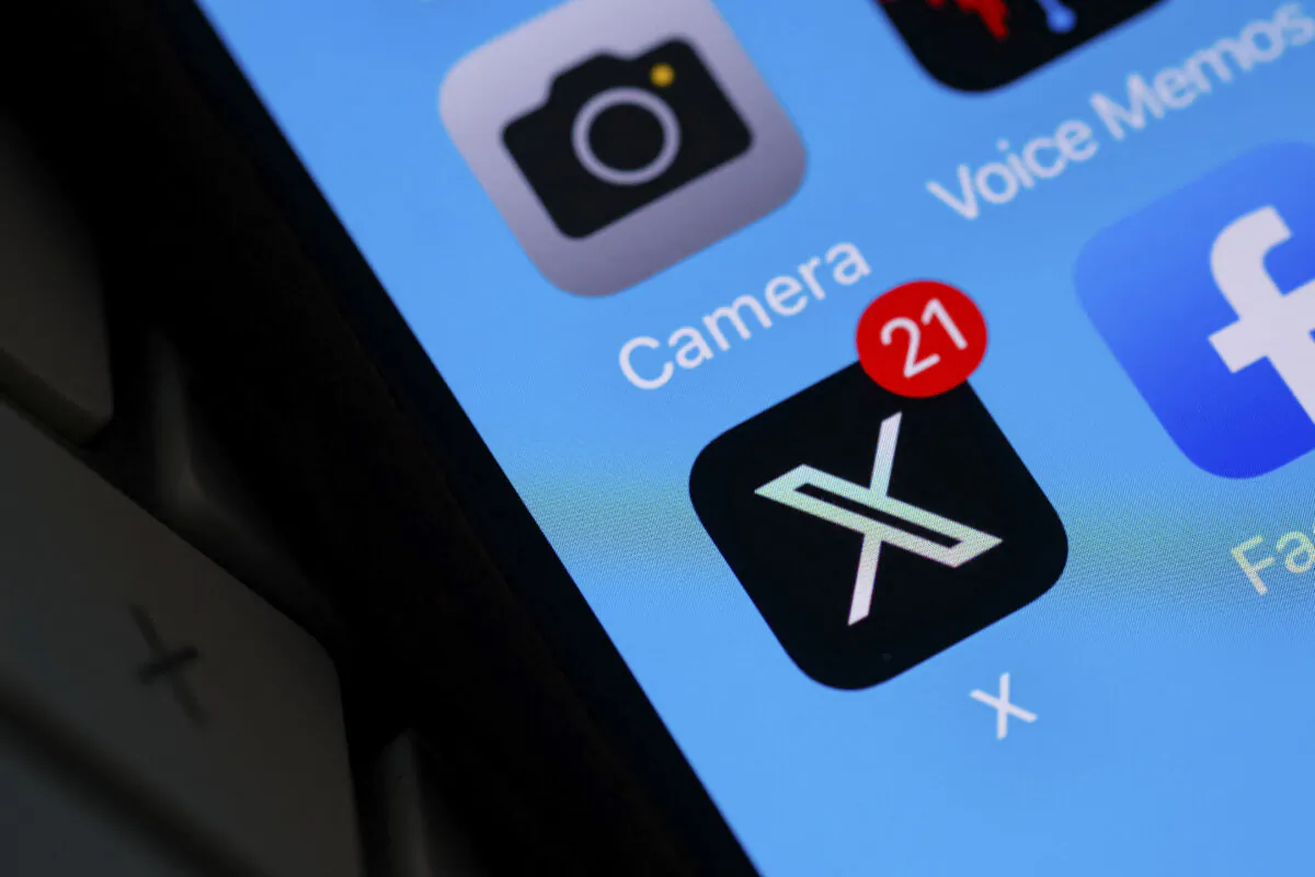 The X logo on a smartphone screen in Los Angeles, Calif., on July 31, 2023. (Chris Delmas/AFP via Getty Images)