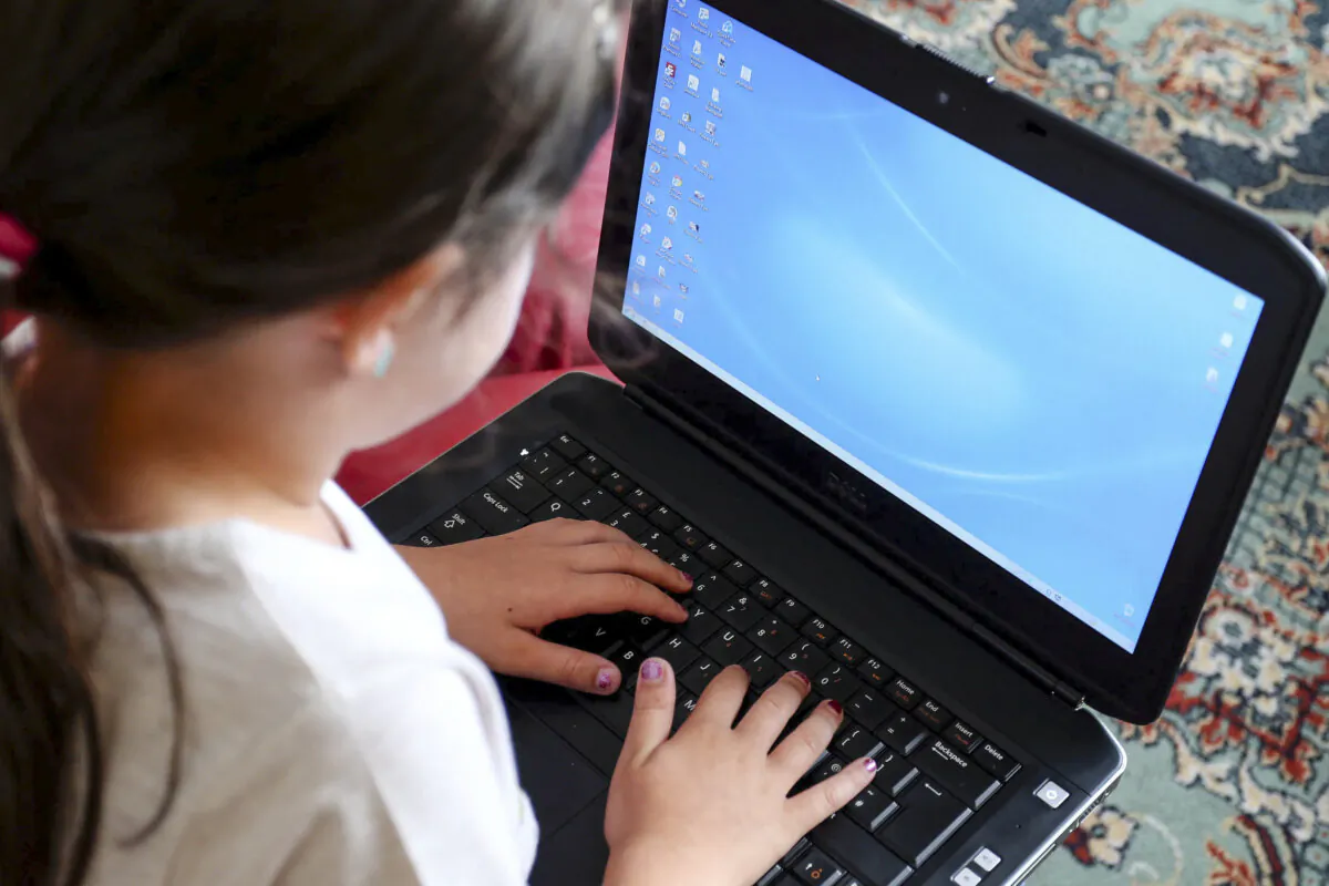 A child using a computer in this undated file photograph. (Peter Byrne/PA Media)
