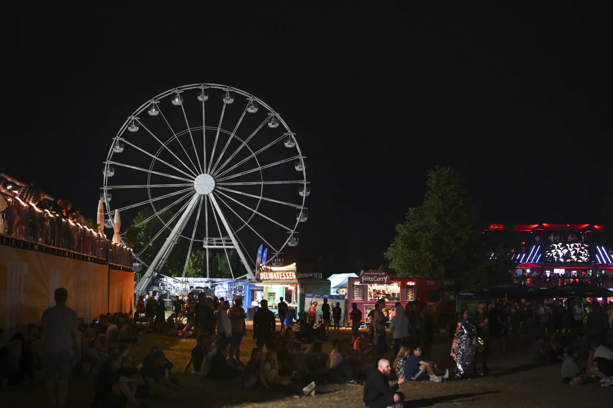 The Ferris wheel after a fire broke out at the Highfield Festival near Leipzig, Germany, on Aug. 18, 2024.  (Heiko Rebsch/dpa via AP)