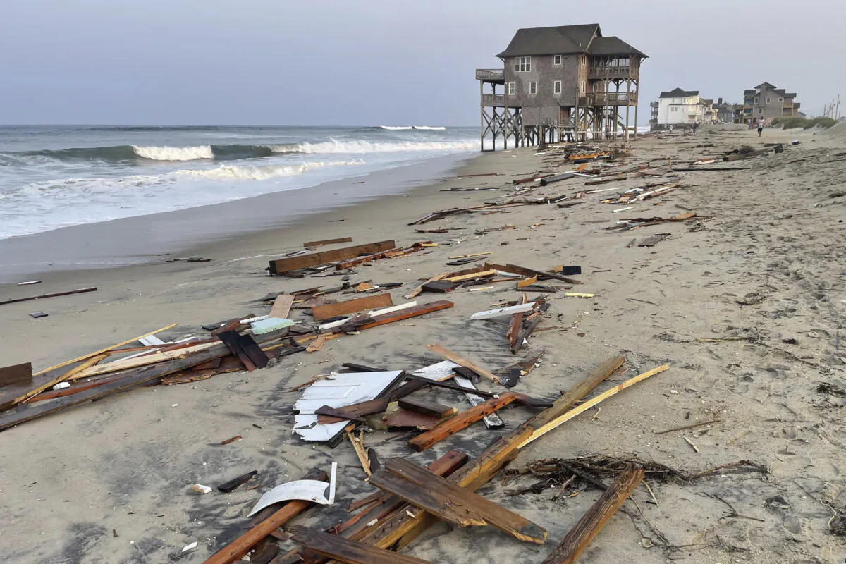 Debris from an unoccupied beach house that collapsed into the Atlantic Ocean from winds and waves caused by Hurricane Ernesto, in Rodanthe, N.C., on Aug. 16, 2024. (Cape Hatteras National Seashore via AP)