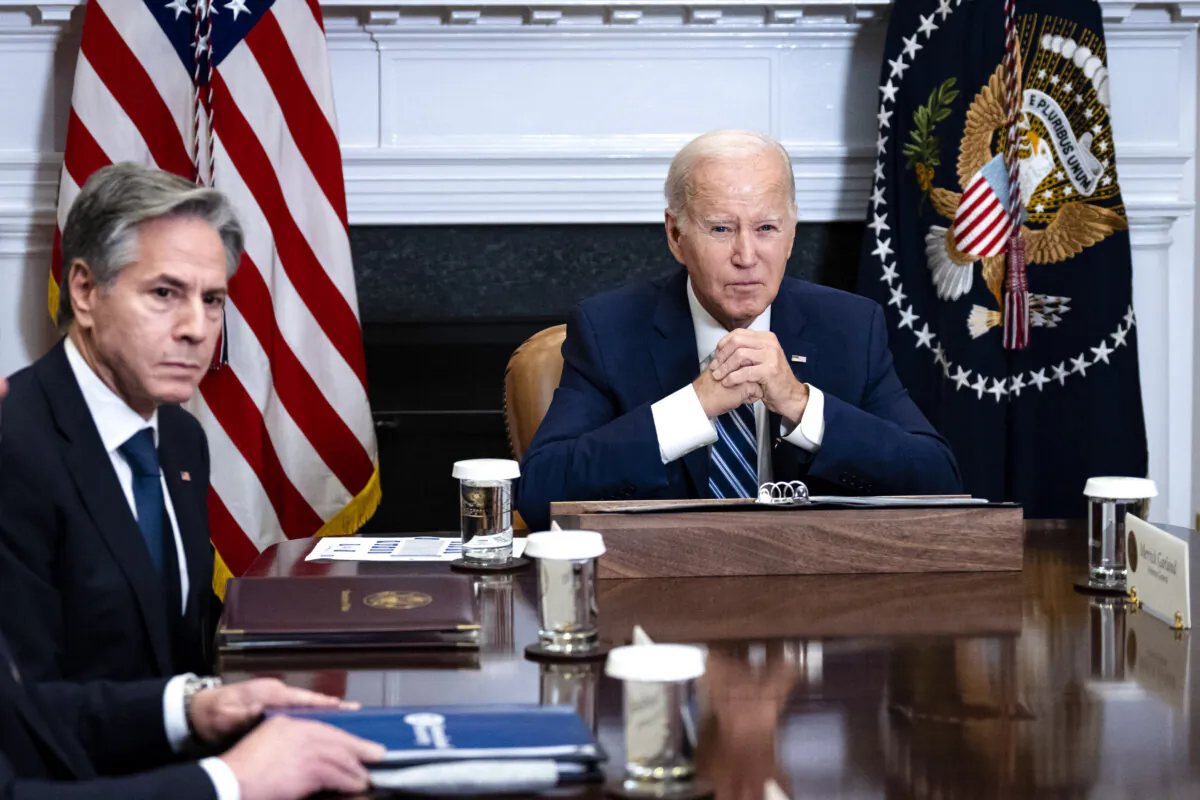 Secretary of State Antony Blinken (L) looks on as President Joe Biden speaks during a meeting in the Roosevelt Room of the White House on Nov. 21, 2023. (Drew Angerer/Getty Images)