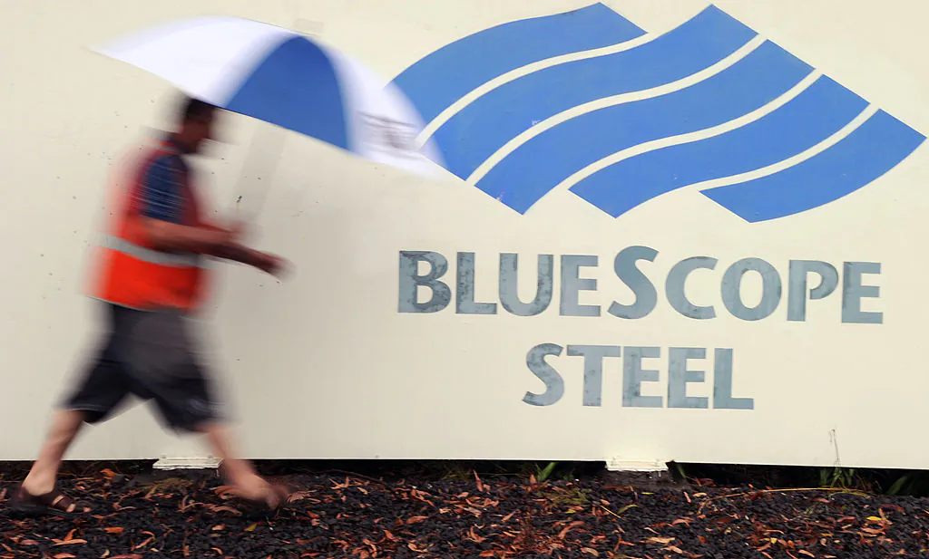 A worker leaves the financially beleaguered BlueScope Steel refinery in Port Kembla near Sydney on November 22, 2011. The company embarked on November 22 on a deeply discounted 600 million USD capital raising to tackle debt and try and turn around its fortunes. Australia's largest steelmaker will use the issue of 1.5 billion new shares to reduce almost 1.6 billion USD in net debt and strengthen its financial position, according to local reports. AFP PHOTO / Torsten BLACKWOOD (Photo credit should read TORSTEN BLACKWOOD/AFP via Getty Images)