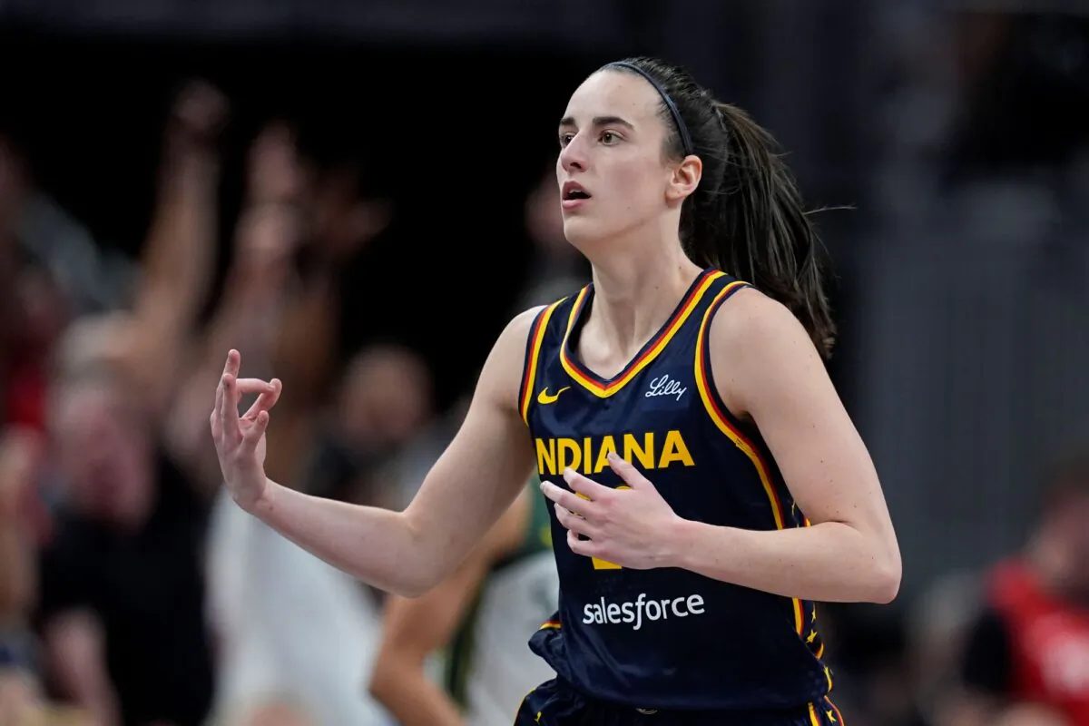 Caitlin Clark of the Indiana Fever reacts after hitting a shot against the Seattle Storm in Indianapolis on Aug. 18, 2024. (Darron Cummings/AP Photo)