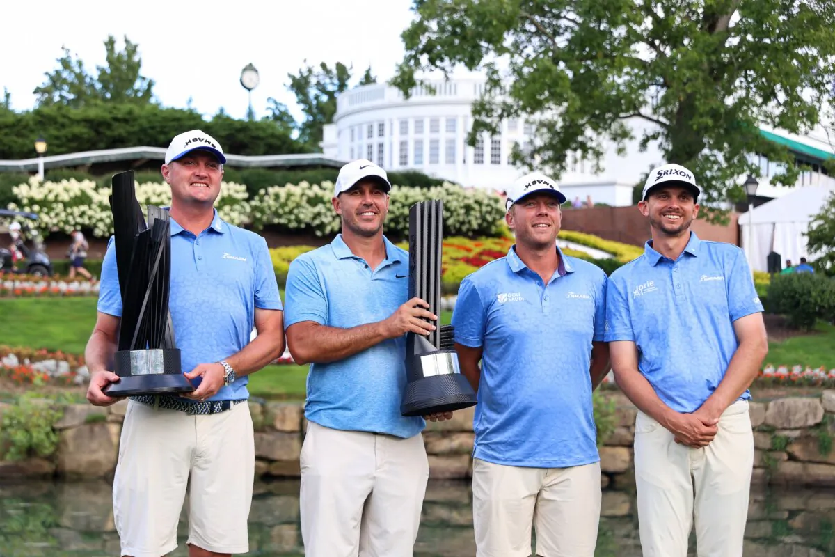 Jason Kokrak of the United States, Brooks Koepka of the United States, Talor Gooch of the United States, and John Catlin of the United States stand with the team trophy after Smash GC wins the team championship during LIV Golf Greenbrier in White Sulphur Springs, W.V., on Aug. 18, 2024.  (Isaiah Vazquez/Getty Images)