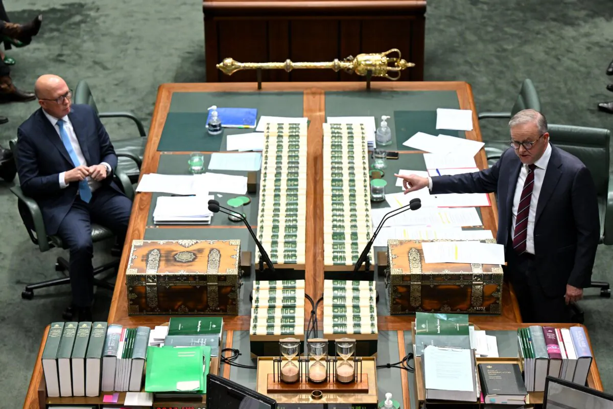 Australian Prime Minister Anthony Albanese speaks to Australian Opposition Leader Peter Dutton during Question Time at Parliament House in Canberra, Australia on Aug. 19, 2024. (AAP Image/Lukas Coch)