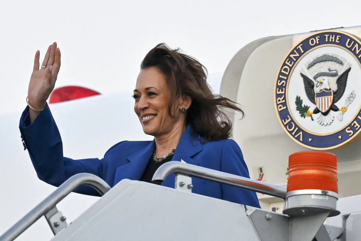 Vice President and Democratic presidential candidate Kamala Harris waves as she steps off Air Force Two upon arrival at Chicago O'Hare International Airport in Chicago on Aug. 18, 2024. (Robyn Beck/AFP via Getty Images)