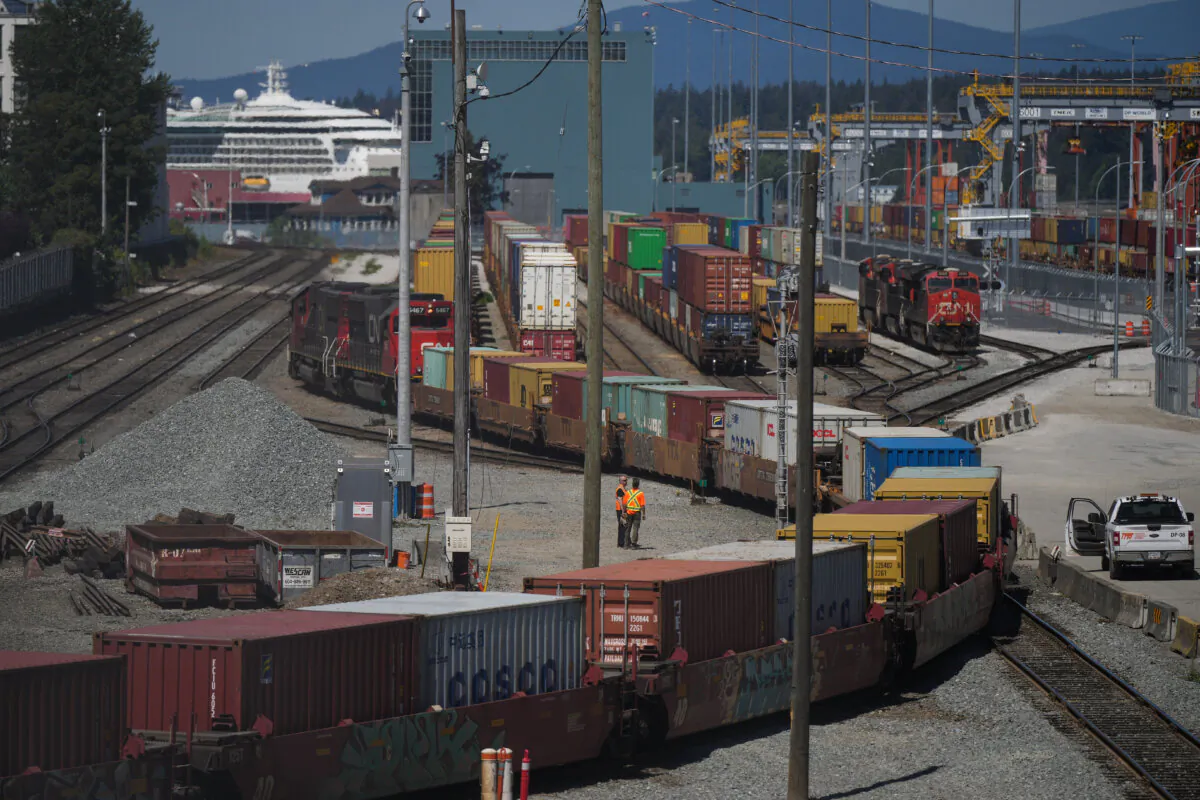 A CN Rail train moves cargo containers at the Centerm Container Terminal at port in Vancouver, on July 14, 2023. (The Canadian Press/Darryl Dyck)