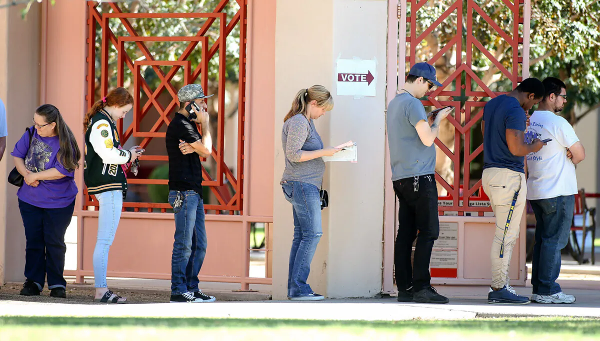 Arizona voters wait in line to cast their ballot at a polling place during the midterm elections in Phoenix on Nov. 6, 2018. (Ralph Freso/Getty Images)