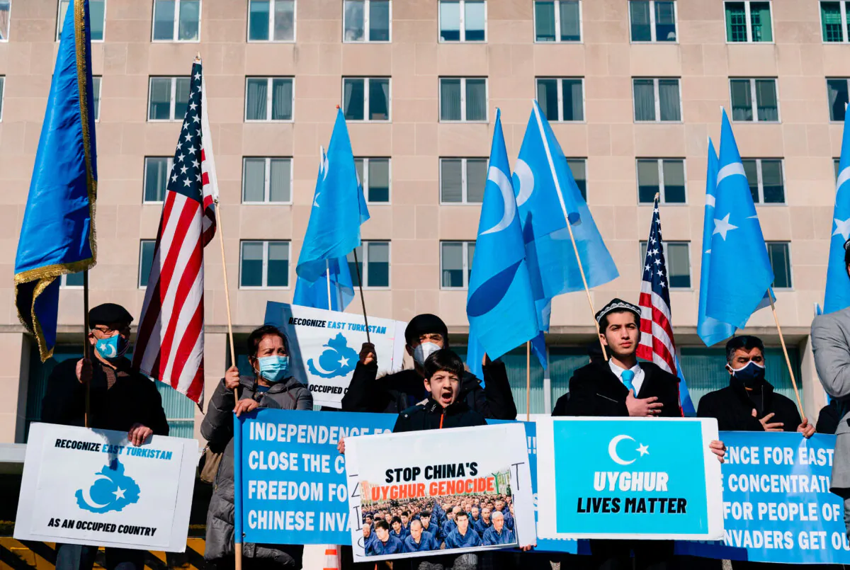 Uyghurs with the East Turkistan National Awakening Movement hold a rally outside the U.S. State Department calling on President Joe Biden to increase pressure on the Chinese Communist Party, in Washington on Feb. 5, 2021 (Alex Edelman/AFP via Getty Images)