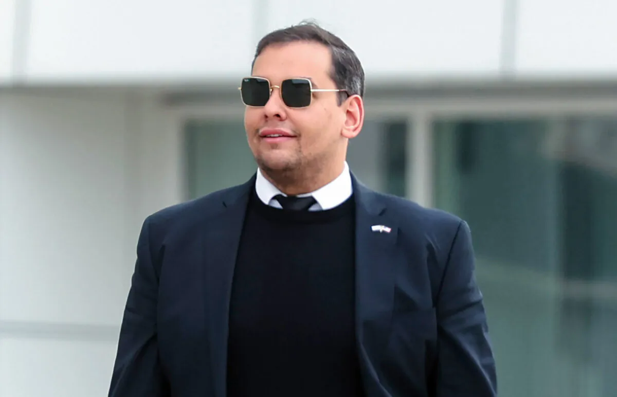 Then-Rep. George Santos (R-N.Y.) walks out of a federal courthouse in Long Island in Central Islip, N.Y., on Oct. 27, 2023. (Spencer Platt/Getty Images)