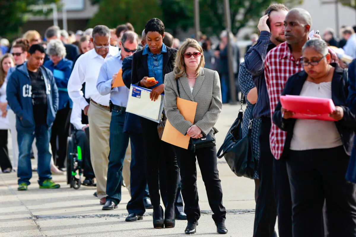 People wait in line to enter the Nassau County Mega Job Fair at Nassau Veterans Memorial Coliseum in Uniondale, N.Y., on Oct. 7, 2014. (Shannon Stapleton/Reuters)