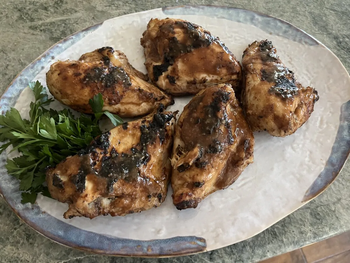 You can start this dish in the morning, refrigerate the chicken, and then grill the chicken pieces just before serving. (Diane Rossen Worthington/TNS)