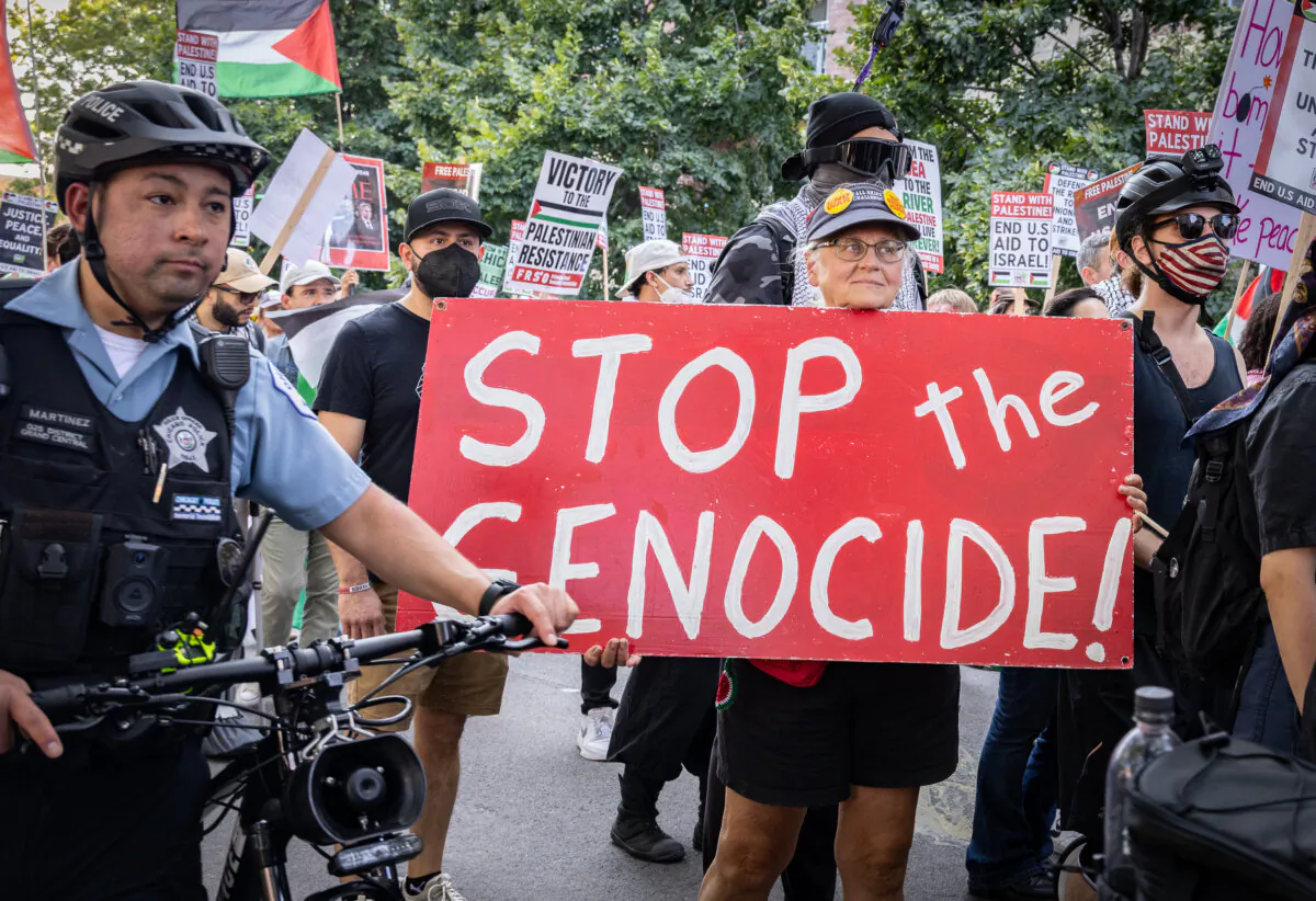 Pro-Palestinian protesters march near the DNC in Chicago, Ill., Aug. 19., 2024. (John Fredricks/The Epoch Times)