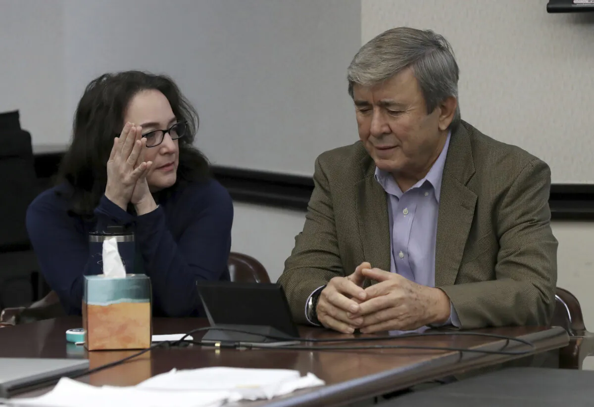 Rose Marie Kosmetatos, (L), and her husband, Antonios Pagourtzis, parents of accused Santa Fe High School shooter Dimitrios Pagourtzis, at the Galveston County Courthouse in Galveston, Texas on Aug. 16, 2024. (Jennifer Reynolds/Pool/The Galveston County Daily News via AP)