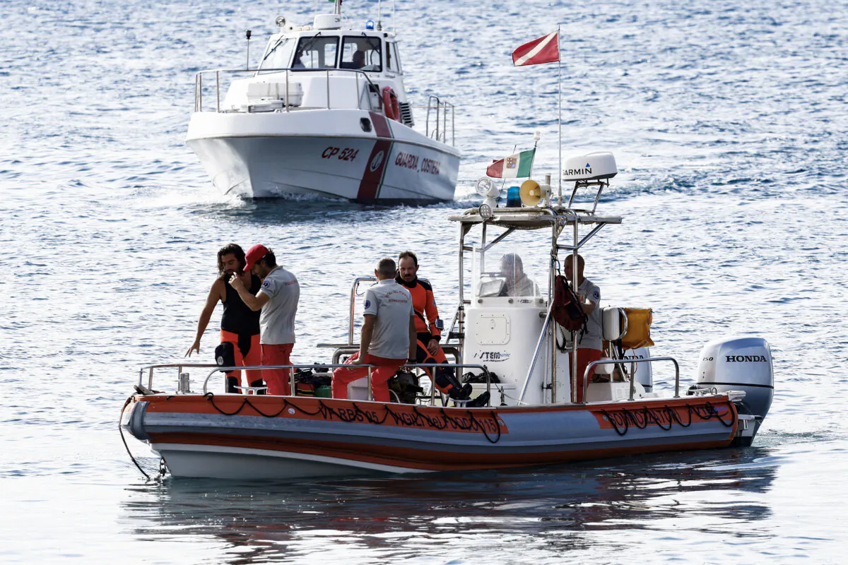 Rescue personnel operate on boats on the sea near the scene where a luxury yacht sank, off the coast of Porticello, near the Sicilian city of Palermo, Italy, on Aug. 20, 2024. (Guglielmo Mangiapane/Reuters)