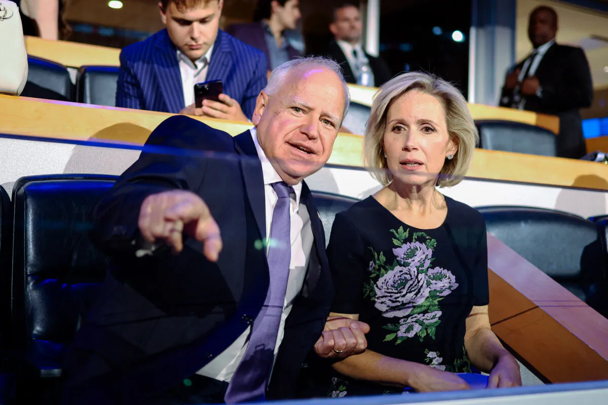 Minnesota Gov. and 2024 Democratic vice presidential candidate Tim Walz and his wife Gwen Walz in Chicago on Aug. 19, 2024. (Charly Triballeau/AFP via Getty Images)