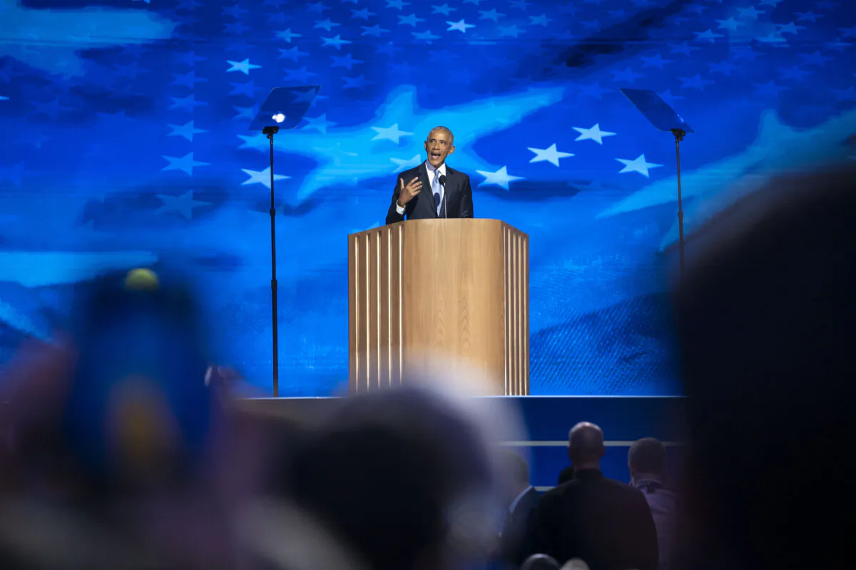 Former President Barack Obama speaks during the second day of the Democratic National Convention (DNC) at the United Center in Chicago on Aug. 20, 2024. (Madalina Vasiliu/The Epoch Times)
