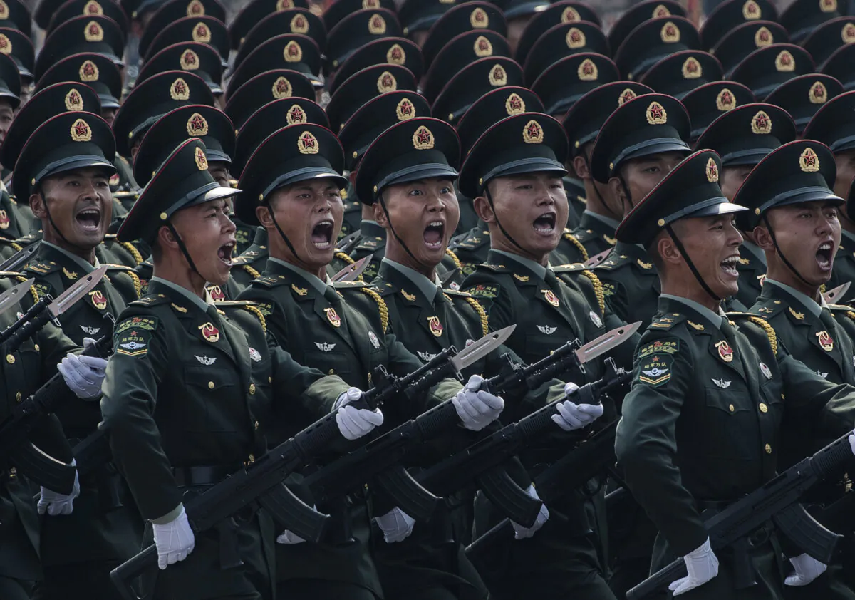 Chinese soldiers shout as they march in formation during a parade to celebrate the 70th anniversary of the founding of communist China at Tiananmen Square in Beijing on Oct. 1, 2019. (Kevin Frayer/Getty Images)