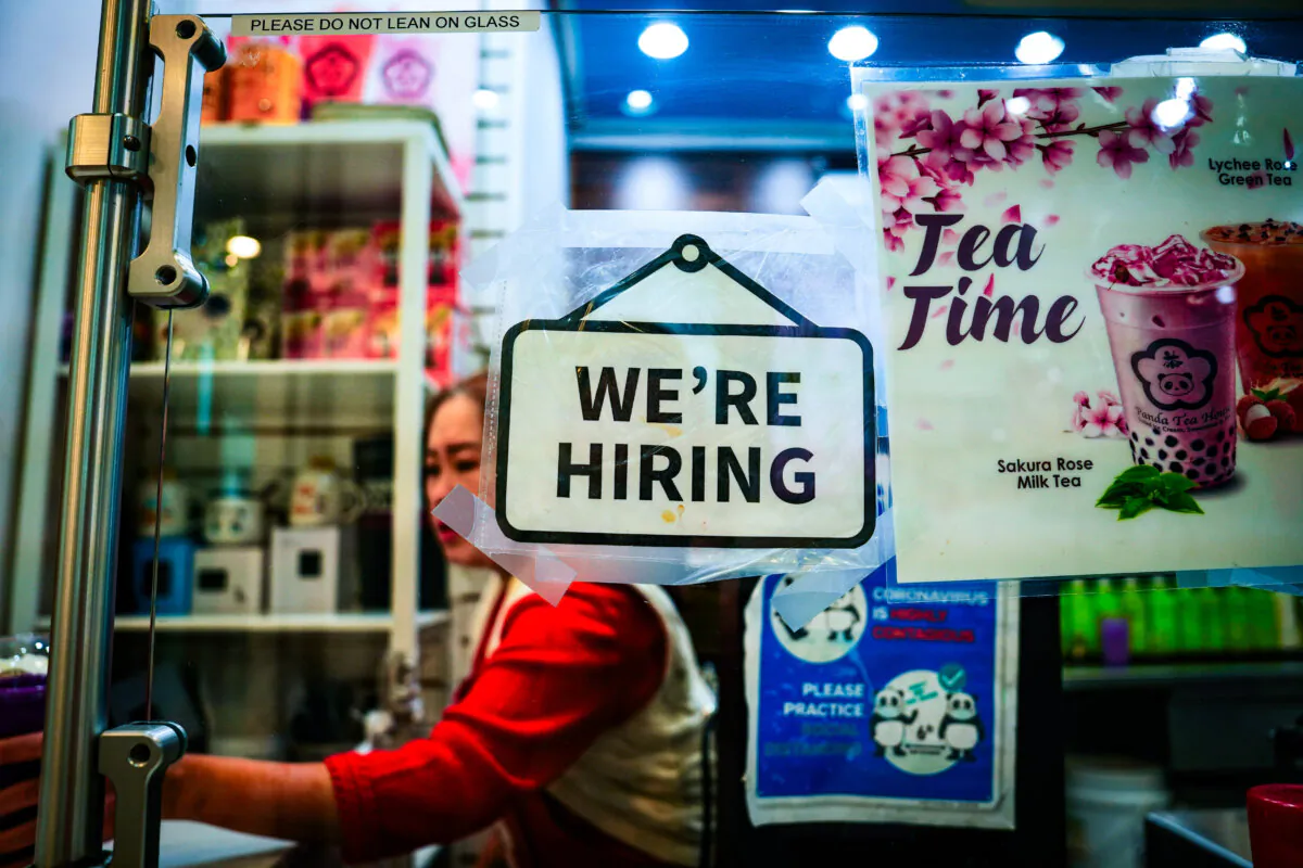 A hiring sign at the Fashion Centre at Pentagon City shopping mall in Arlington, Va., on Jan 3, 2024. (Madalina Vasiliu/The Epoch Times)
