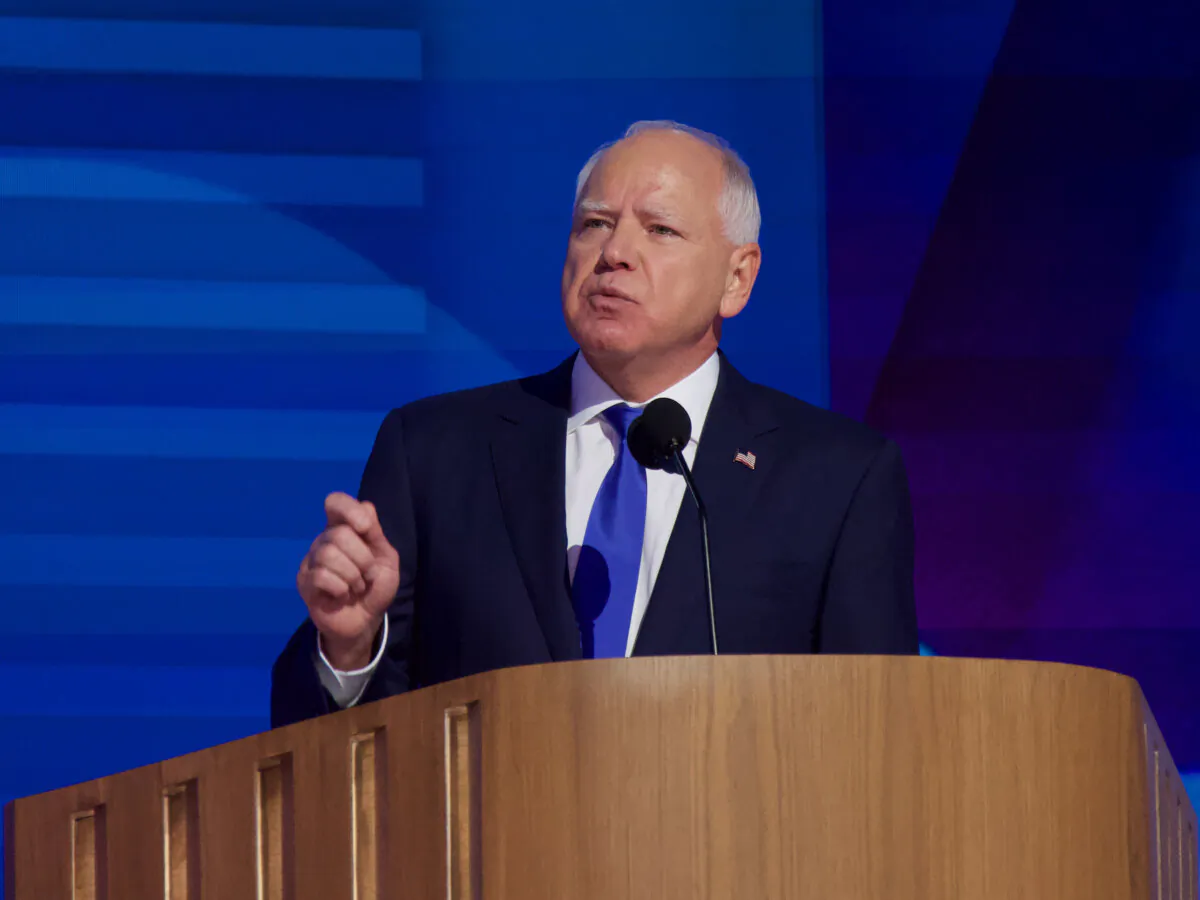 Gov. Tim Walz speaks at the Democratic National Convention in Chicago, Illinois on Aug. 21, 2024. (Travis Gillmore/The Epoch TImes)