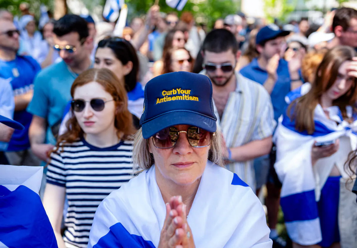 A woman wears a hat that reads "Curb Your Antisemitism" during a rally at George Washington University in Washington on May 2, 2024. (Andrew Harnik/Getty Images)