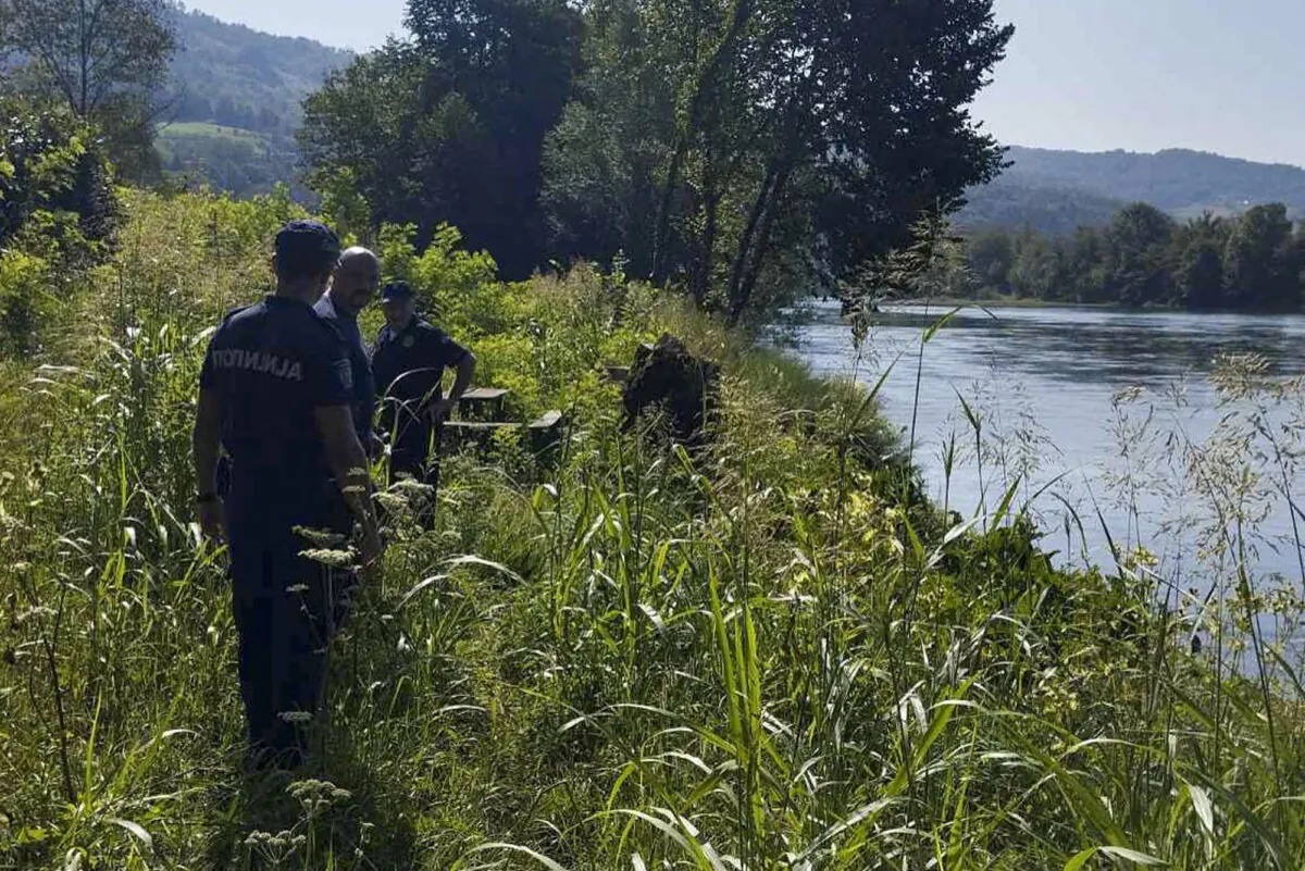 Serbian Police officers search a bank of the Drina River near the town of Ljubovija, Serbia, on Aug. 22, 2024. (Serbian Ministry of Interior via AP)