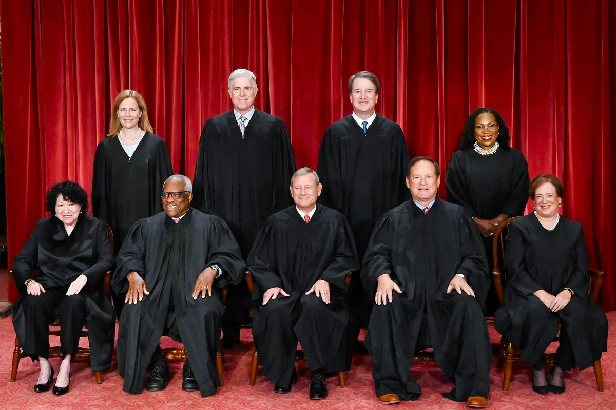 Justices of the U.S. Supreme Court pose for their official photo at the Supreme Court in Washington on Oct. 7, 2022. (Front L–R) Justices Sonia Sotomayor and Clarence Thomas, Chief Justice John Roberts, Justices Samuel Alito and Justice Elena Kagan. (Back L–R) Justices Amy Coney Barrett, Neil Gorsuch, Brett Kavanaugh, and Ketanji Brown Jackson. (Olivier Douliery/AFP via Getty Images)