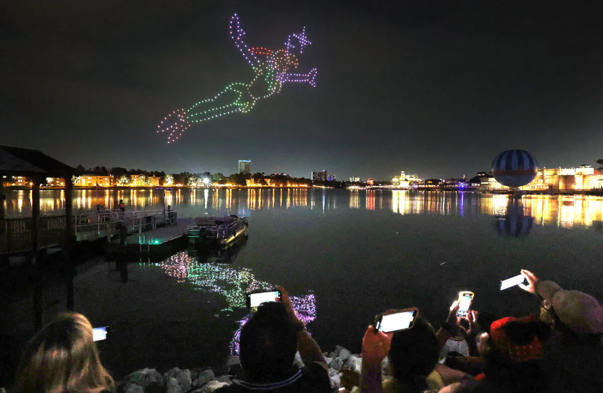 A Disney Peter Pan figure appears over the waterfront during the Drone Show at Disney Springs on Aug. 7, 2024, in Lake Buena Vista, Florida. (Stephen M. Dowell/Orlando Sentinel/TNS)