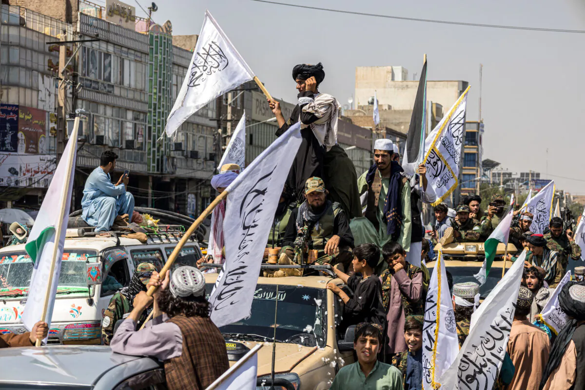 A convoy of Taliban security personnel moves along the streets as they celebrate the third anniversary of the Taliban takeover of Afghanistan, in Herat on Aug. 14, 2024. (Mustafa Noori / Middle East Images / Middle East Images via AFP)