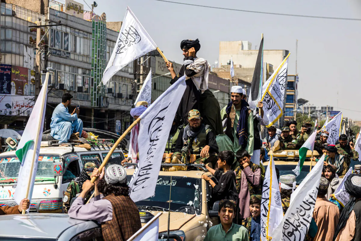 A convoy of Taliban security personnel is seen moving along the streets as they celebrate the third anniversary of the Taliban takeover of Afghanistan, in Herat on August 14, 2024. (Mustafa Noori / Middle East Images / Middle East Images via AFP)