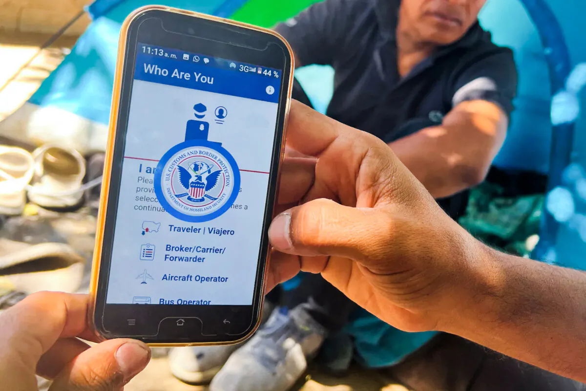 A migrant shows the CBP One App from the Customs and Border Protection agency, to use to apply for an appointment to claim asylum, on a phone in Ciudad Juarez, Chihuahua state, Mexico, on May 10, 2023. (Gilles Clarenne/AFP via Getty Images)