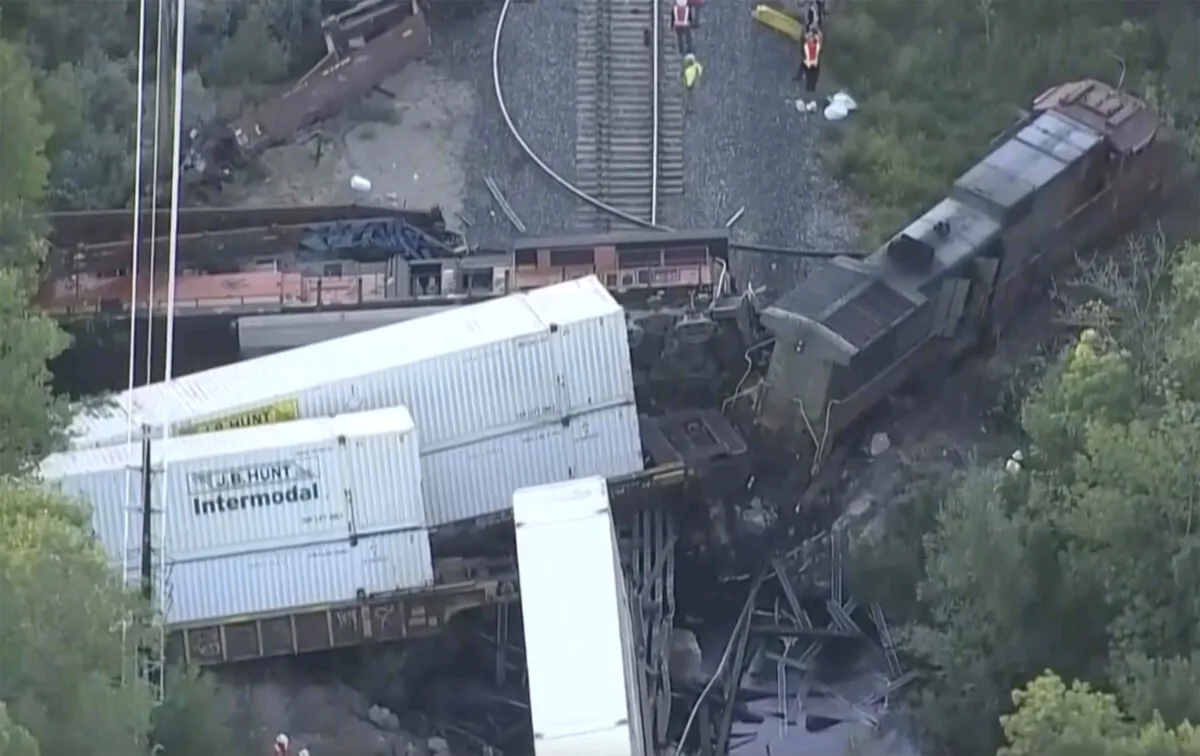 Investigators work the scene, Friday, Aug. 23, ,2024, where two freight trains collided and derailed in Boulder, Colo., on Thursday night, (Denver7 via AP)