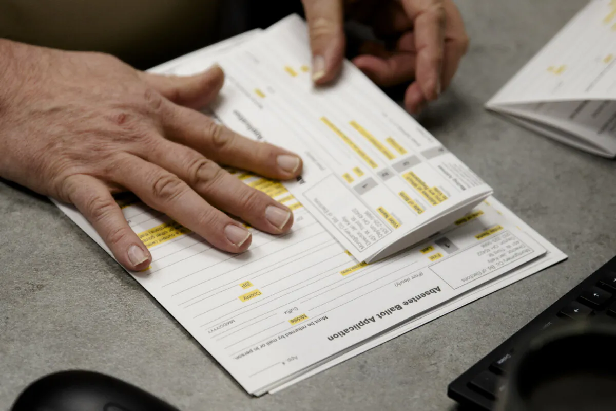 A county election worker prepares absentee ballots in Dayton, Ohio, on March 17, 2020. (Megan Jelinger/AFP via Getty Images)