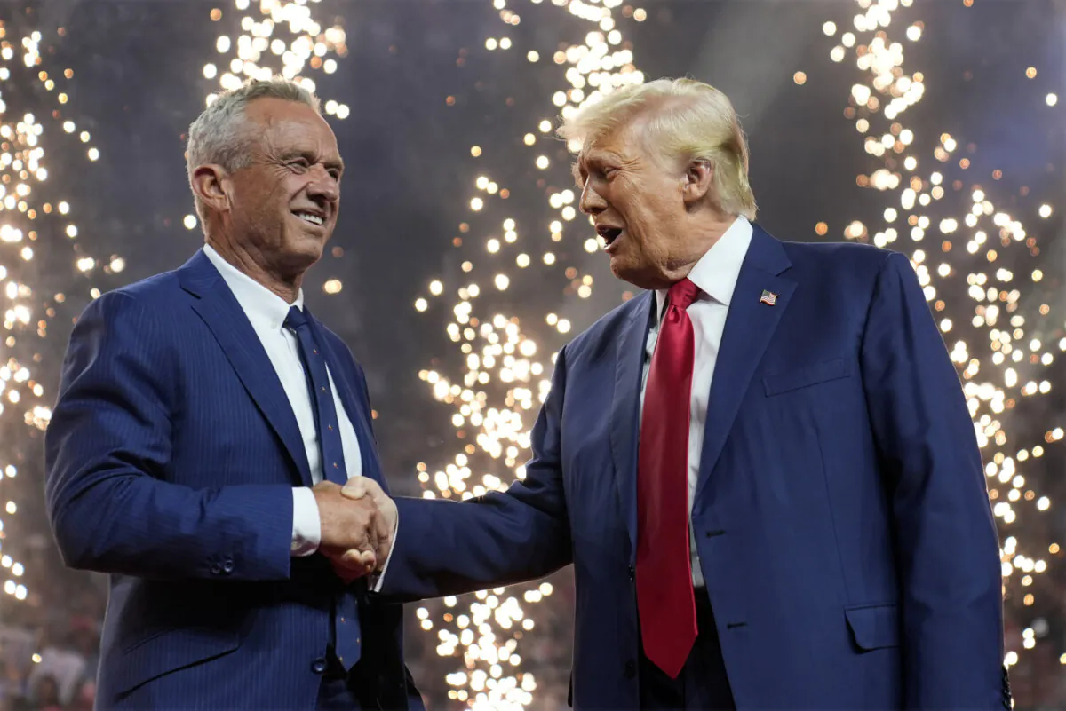 Republican presidential nominee former President Donald Trump shakes hands with independent presidential candidate Robert F. Kennedy Jr. at a campaign rally at the Desert Diamond Arena in Glendale, Ariz., on Aug. 23, 2024. (Evan Vucci/AP Photo)