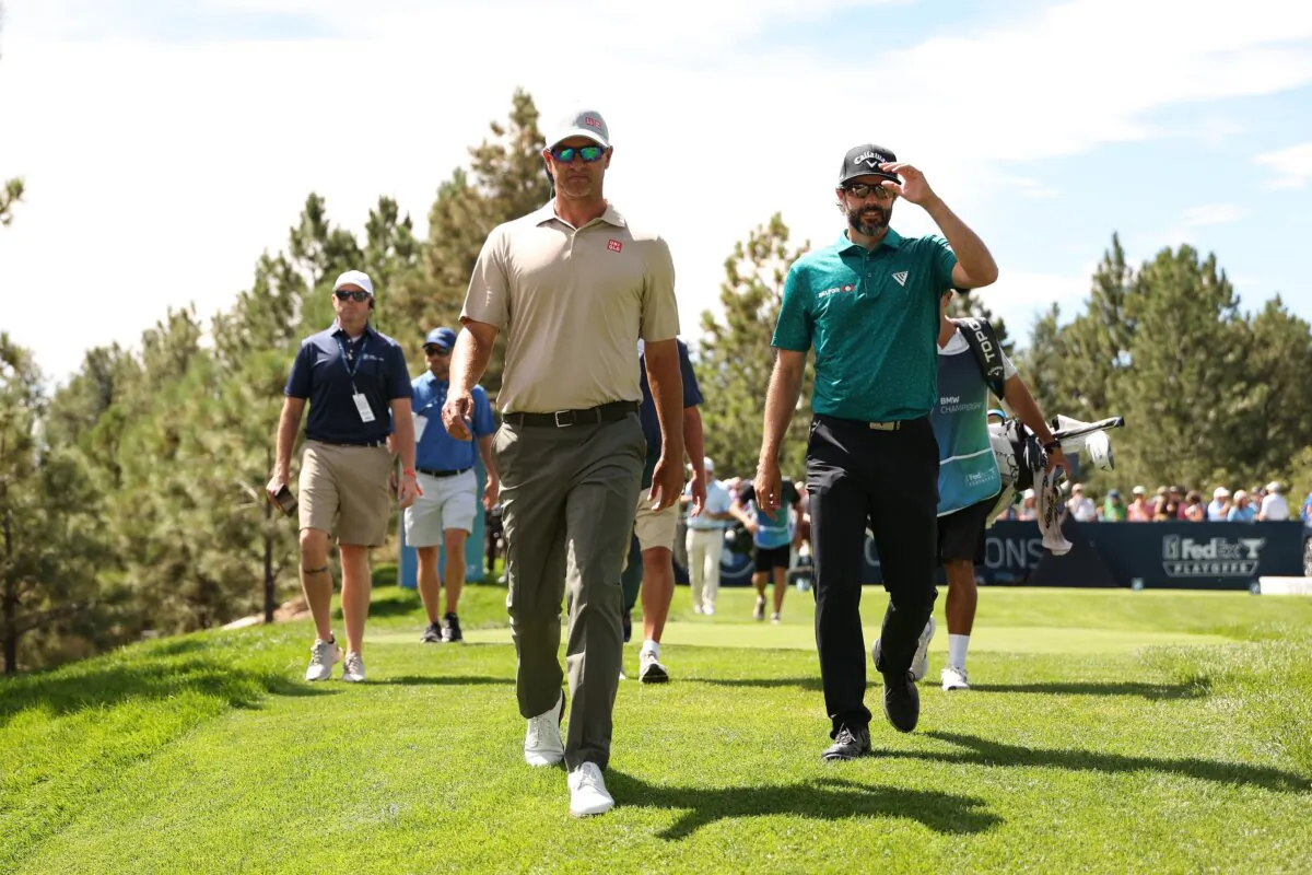 Adam Scott of Australia and Adam Hadwin of Canada walks the 18th fairway during the second round of the BMW Championship in Castle Rock, Colo., on August 23, 2024. (Christian Petersen/Getty Images)