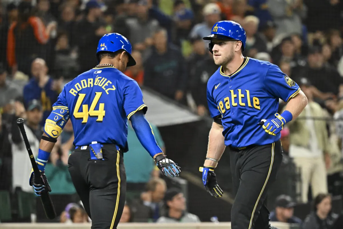 Luke Raley (R) (20) of the Seattle Mariners celebrates with Julio Rodriguez (44) after hitting a solo home run during the fifth inning against the San Francisco Giants in Seattle on Aug. 23, 2024. (Alika Jenner/Getty Images)