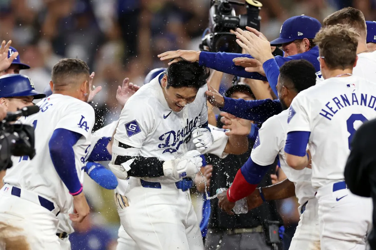 Shohei Ohtani (17) of the Los Angeles Dodgers celebrates with teammates after hitting a walk-off grand slam home run during the ninth inning against the Tampa Bay Rays in Los Angeles on Aug. 23, 2024. (Katelyn Mulcahy/Getty Images)