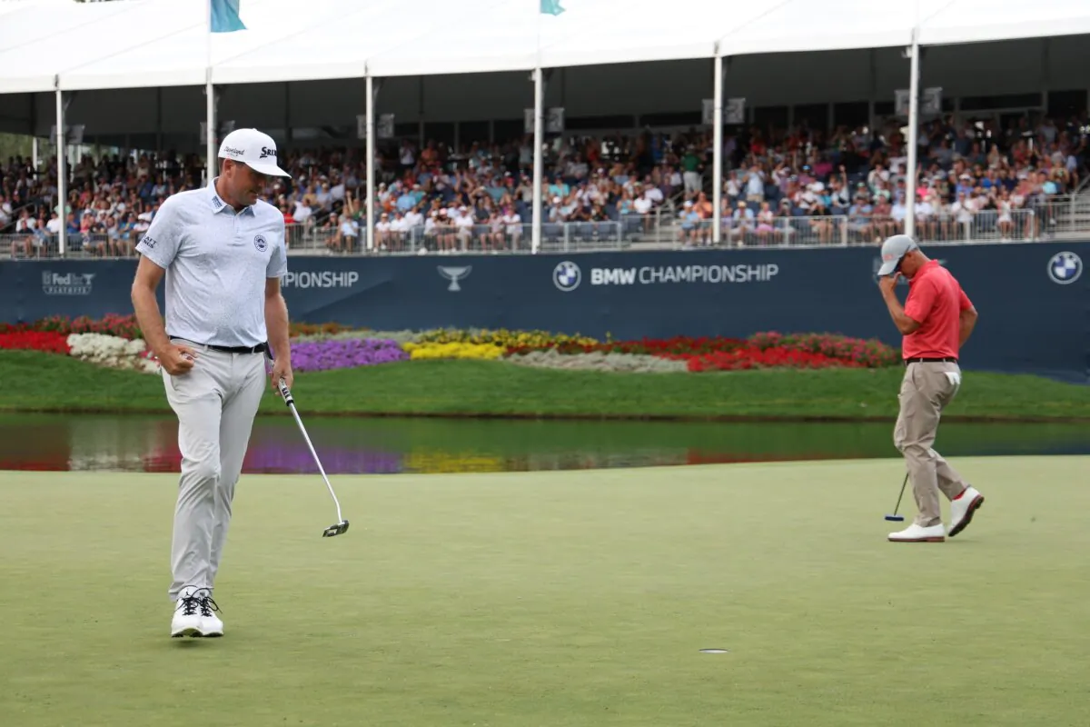 Keegan Bradley of the United States reacts as Adam Scott of Australia looks on on the 15th green during the third round of the BMW Championship at Castle Pines Golf Club in Castle Rock, Colo., on August 24, 2024. (Harry How/Getty Images)