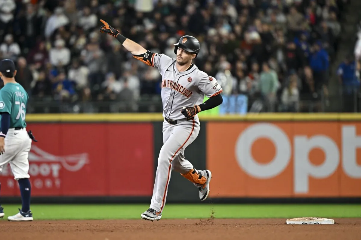 Mike Yastrzemski (5) of the San Francisco Giants gestures after hitting a solo home run during the seventh inning against the Seattle Mariners in Seattle on Aug. 24, 2024. (Alika Jenner/Getty Images)