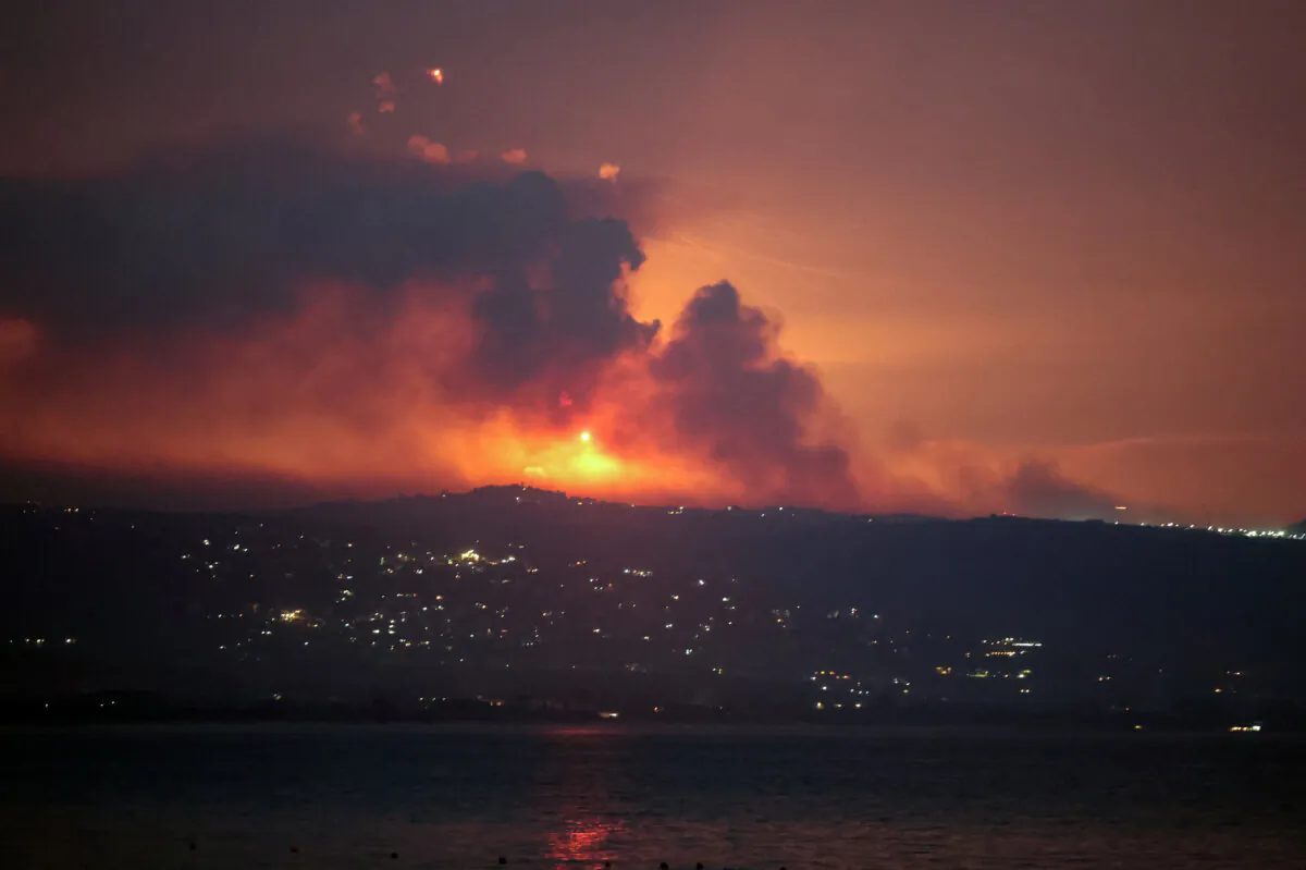 Smoke and fire on the Lebanese side of the border with Israel, after Israel said it had noted the Hezbollah terrorist group preparing to attack Israel and had carried out strikes on Hezbollah targets in Lebanon, as seen from Tyre, southern Lebanon, on Aug. 25, 2024. (Aziz Taher/Reuters)