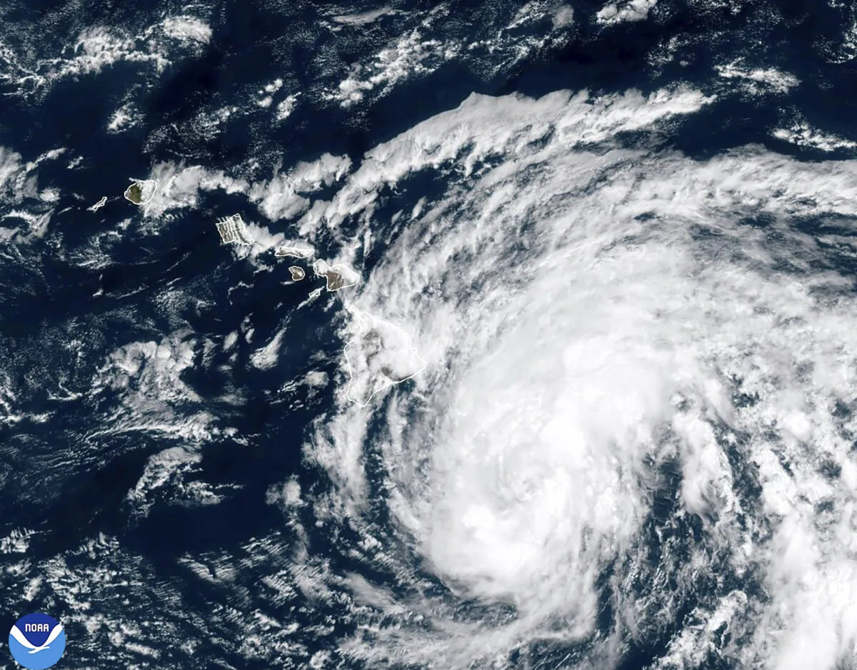 A satellite image shows Tropical Storm Hone as it continues to track to the west toward the Hawaiian Islands on Aug. 24, 2024. (National Oceanic and Atmospheric Administration via AP)