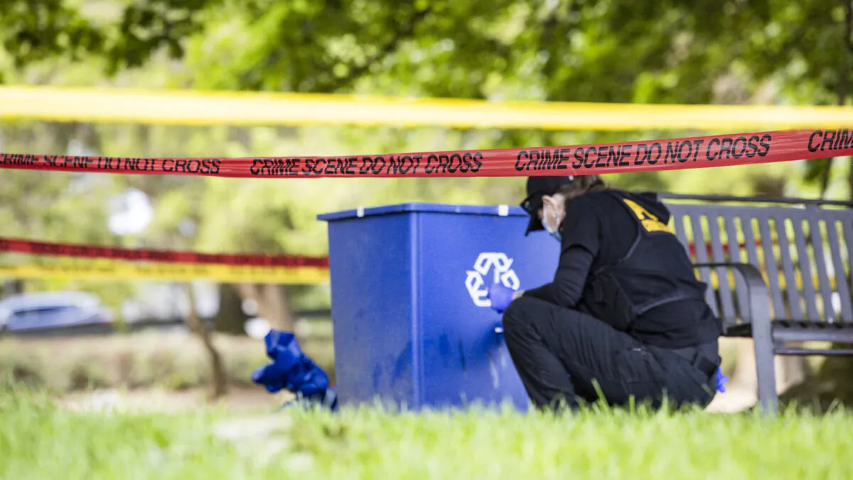 Police investigate the scene where dog walker Ruth Dalton, 80, was reported killed at Brighton Playfield, in Seattle, on Aug. 20, 2024. (Ivy Ceballo/The Seattle Times via AP)