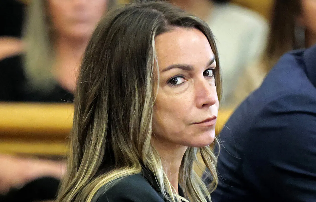 Karen Read looks toward the jurors, as they are greeted by Judge Beverly J. Cannone during her trial at Norfolk Superior Court in Dedham, Mass., on July 1, 2024. (Pat Greenhouse/The Boston Globe via AP, Pool)