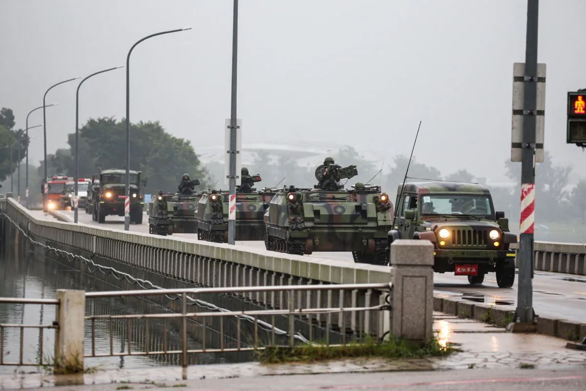Taiwanese armored vehicles roll down a street in Kinmen Islands, Taiwan, on May 24, 2024. (I-Hwa Cheng/AFP via Getty Images)