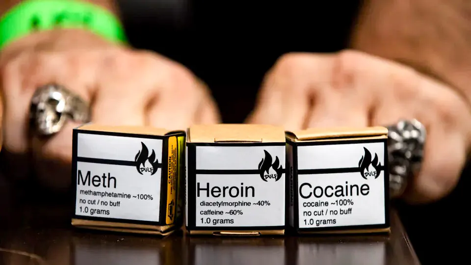 Methamphetamine, heroin, and cocaine from a safe supply being handed out to drug users to mark International Overdose Awareness Day are displayed in the Downtown Eastside neighbourhood of Vancouver on Aug. 31, 2021. (The Canadian Press/Darryl Dyck)