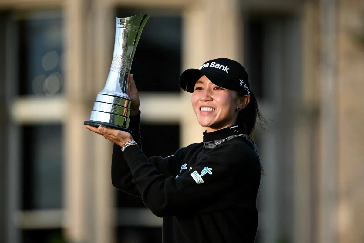 Lydia Ko poses with the trophy after winning the Women's British Open in St Andrews, Scotland, on Aug. 25, 2024. (Andy Buchanan/AFP/Getty Images)