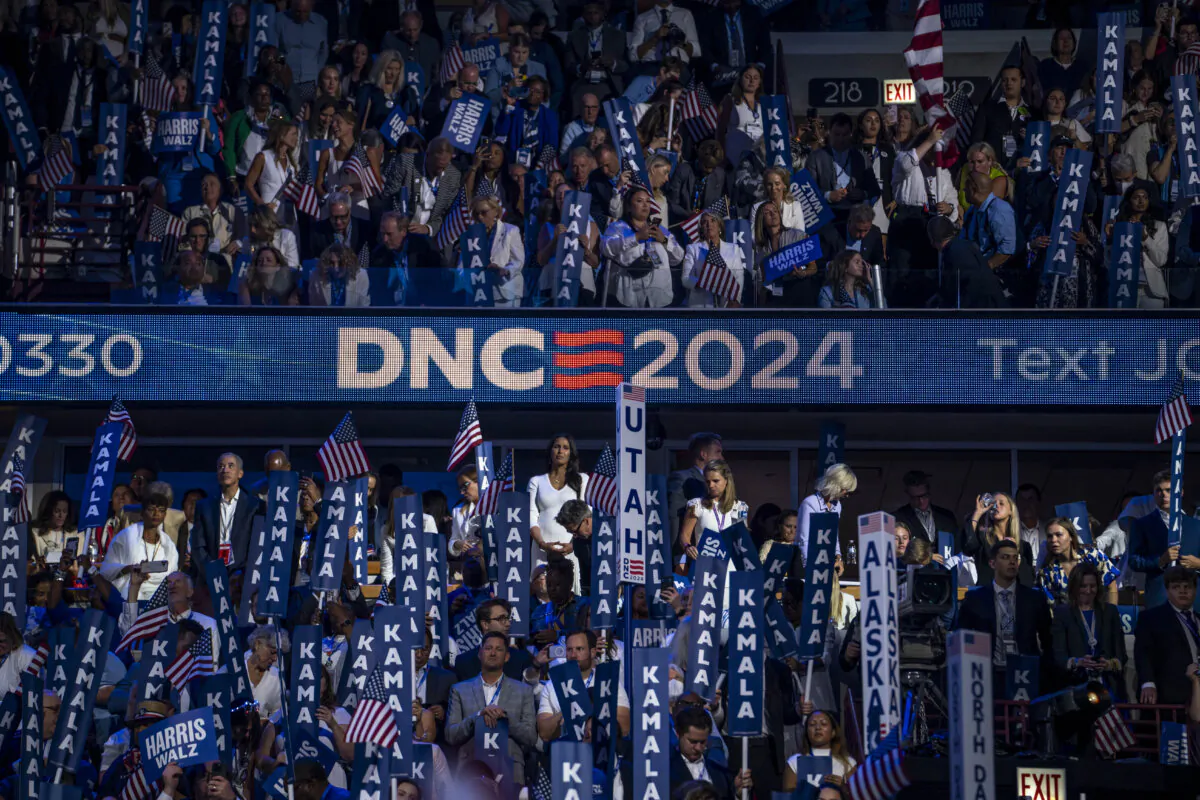 Delegates listen to Vice President and Democratic presidential nominee Kamala Harris's speech on the last day of the Democratic National Convention in Chicago on Aug. 22, 2024. (Madalina Vasiliu/The Epoch Times)